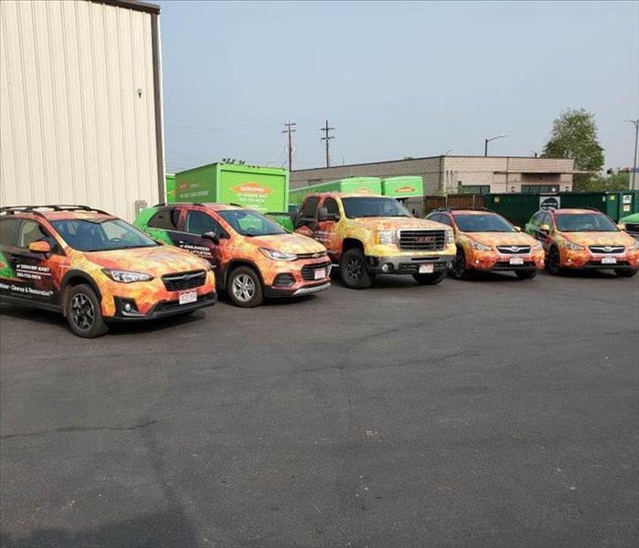 SERVPRO of Engelwood/East Littleton's fleet of vehicles lined up in the facility parking lot
