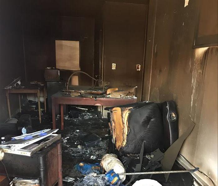 Office with fire and soot damage.