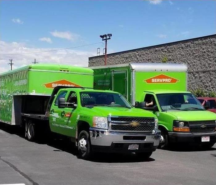 Two SERVPRO semi truck on the road 