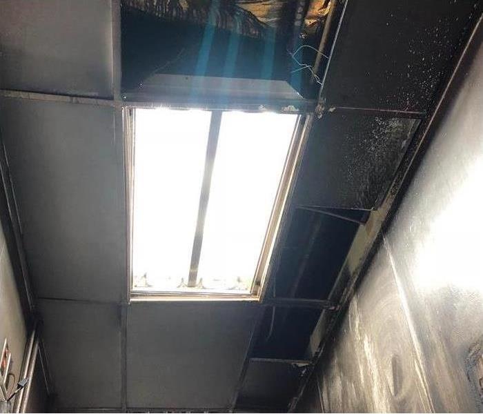 Smoke damage on ceiling of commercial building
