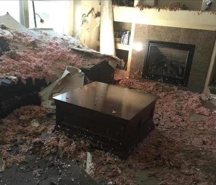 Insulation all over a living room, due to fire damage caused in a home