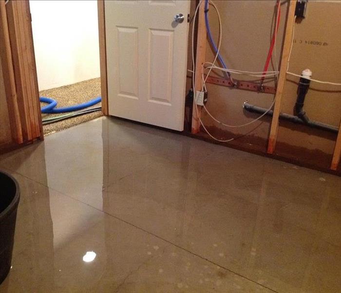 standing clear water on the floor. Water damage in a room